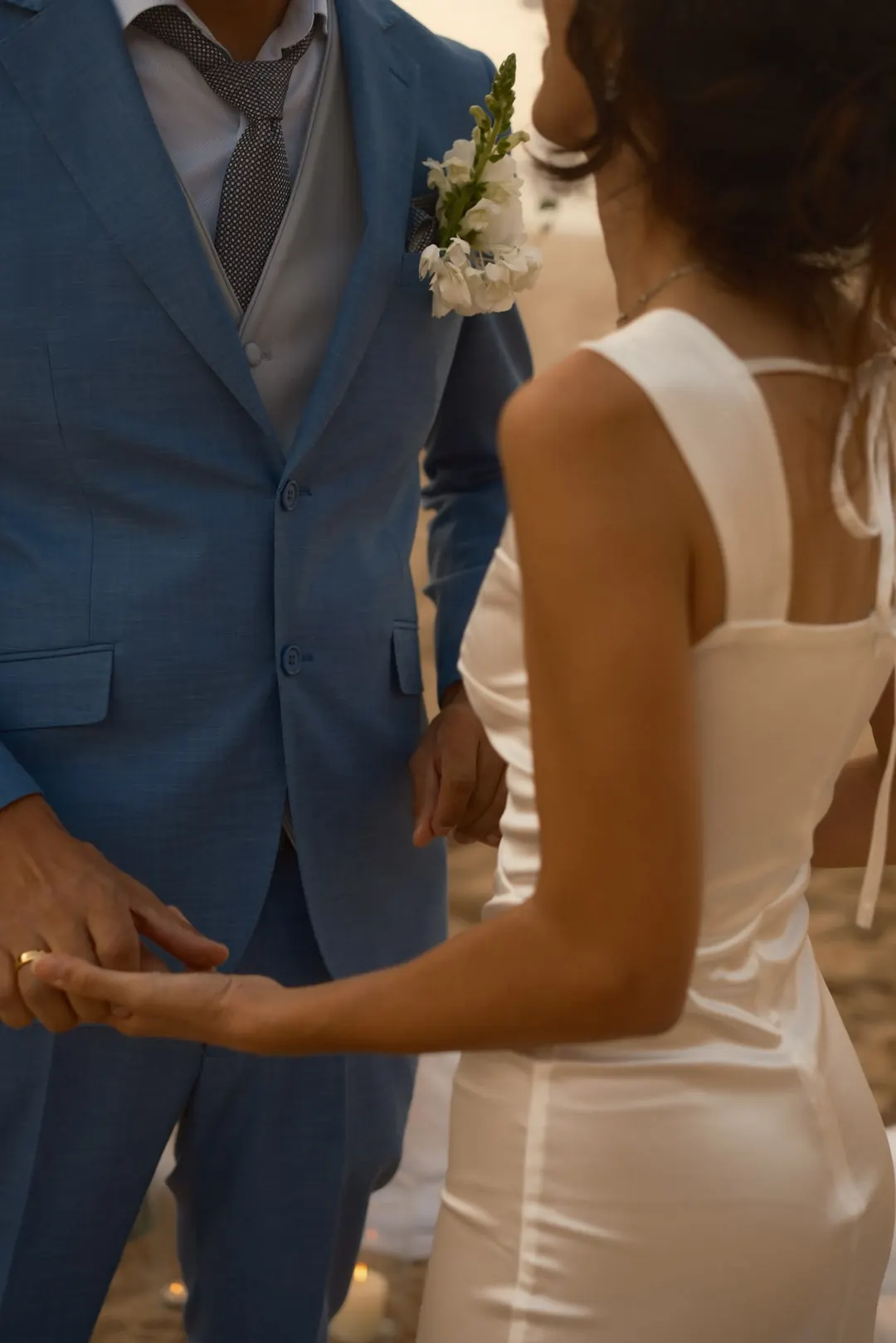 Their hands, close, after the vows